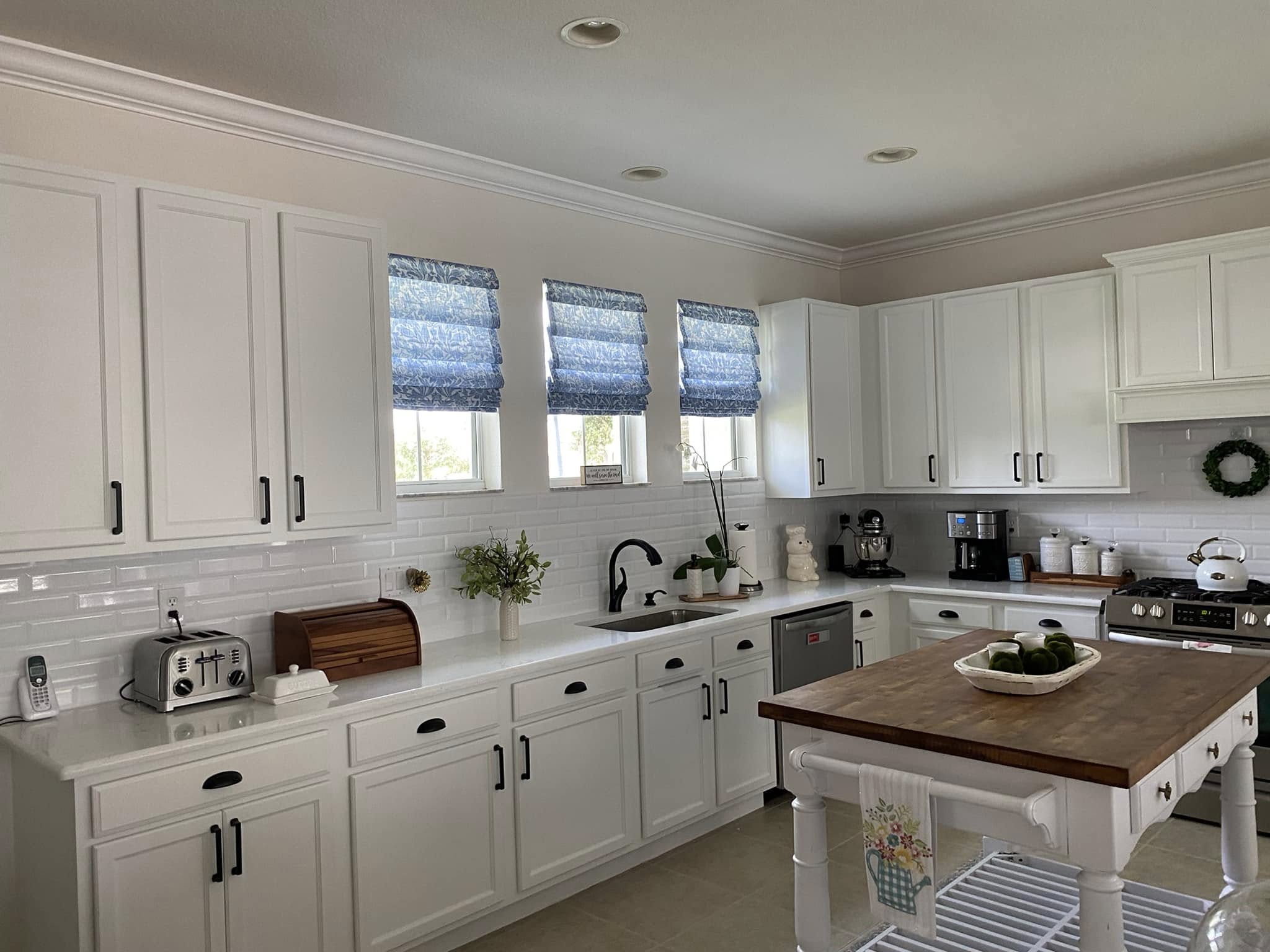 Custom white kitchen cabinets and farmhouse-style finishes, kitchen remodel in Port St. Lucie, FL by Dependable Guys LLC
